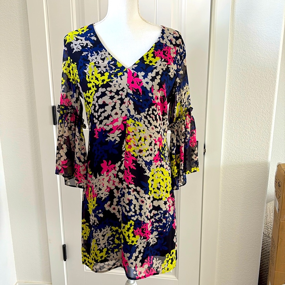 Adorable dress with flowy sleeves. 34” from shoulder to hem.